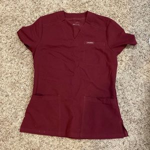 Jaanuu “relaxed fit 3-pocket scrub top” in wine